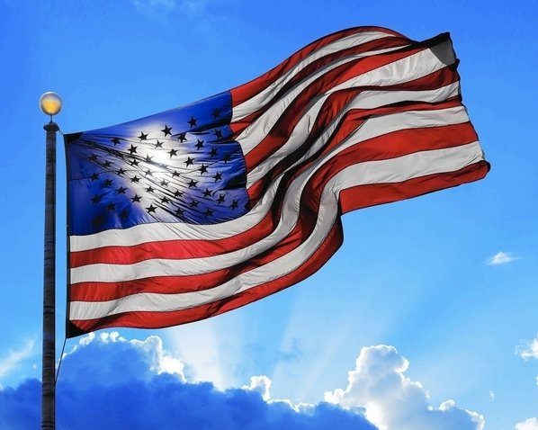 american flag waving on flag pole