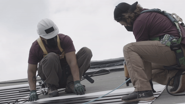 Roofers installing solar gif