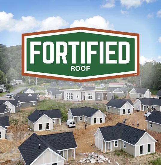 FORTIFIED roofs shingle roofs at Sawmill Village against the western North Carolina mountains