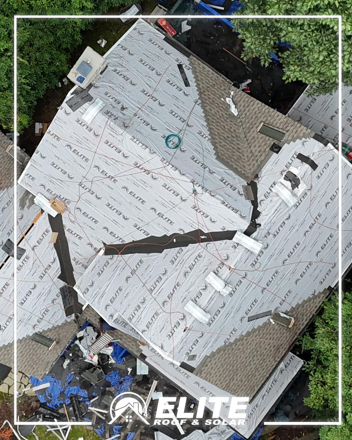 Roofing underlayment on a roof replacement: synthetic underlayment with ice and water shield in the valleys